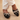 Woman wearing black mules, front shot